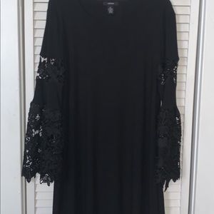 Little black dress with lace bellbottom sleeves